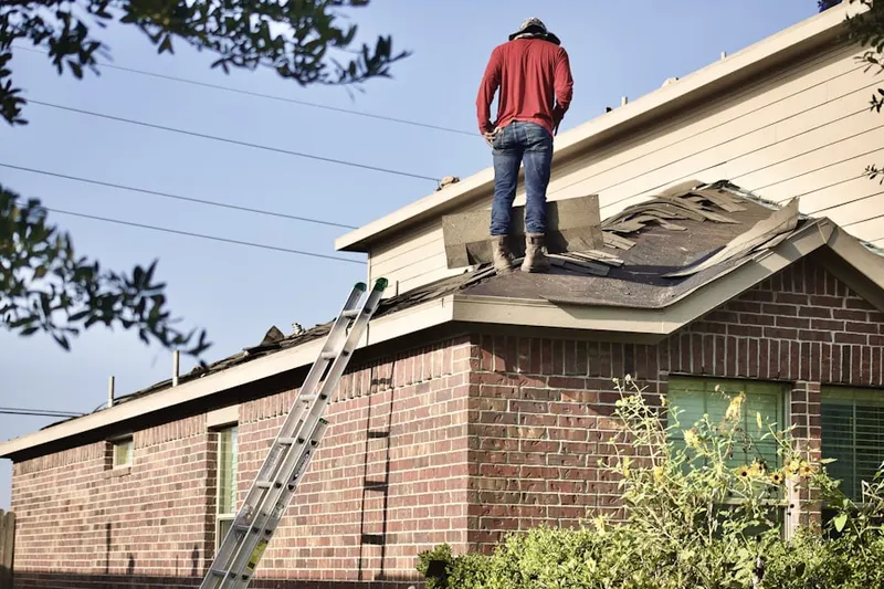 Professional roofer working on a residential roof in Koreatown